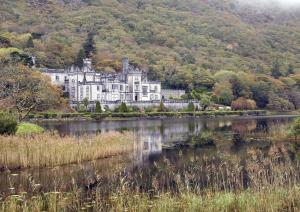 a castle in the middle of a lake at Cottage 503 - Leenane in Leenaun