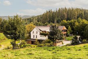 an aerial view of a large white house on a hill at Statek Samsara in Blansko