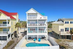 an aerial view of a house with a swimming pool at Five on the Beach by Pristine Property Vacation Rentals in Cape San Blas