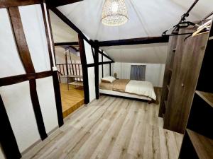 a bedroom with a bed in a tent at Bohéme Chic in Saint-Dizier