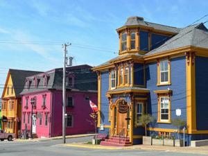 a row of colorful houses on a city street at Mariner King Inn in Lunenburg