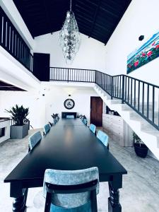 a large conference room with a large table and chairs at ARHH castle in Ginigathena