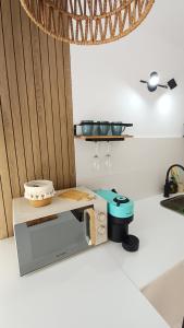 a kitchen with a counter with a toaster on a counter at Seabird Lisbon Studio in Charneca