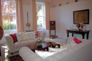 a living room with two couches and a table at Collins House in Knaresborough +20 photos