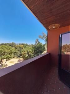 a room with a balcony with a view of the desert at Résidence Marotia in Antananarivo