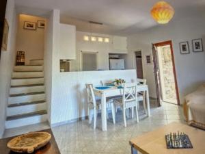 a kitchen and dining room with a table and chairs at Villa Vassia in Koundouros