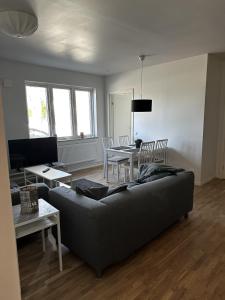 a living room with a couch and a table at Sörbyvägen 4 in Floby