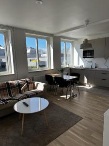 a living room with a couch and a table at Sörbyvägen 4 in Floby