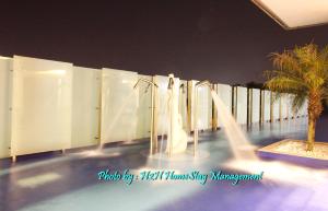 a water park at night with a water slide at Majestic Cottage in Ipoh