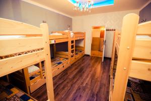a room with two bunk beds and a hallway at Greg&Tom Beer House Hostel in Krakow