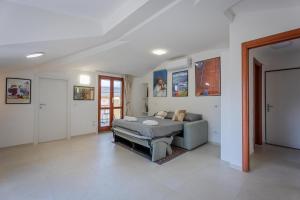 a living room with a couch and a table at Marble House Varenna Lake Como in Varenna