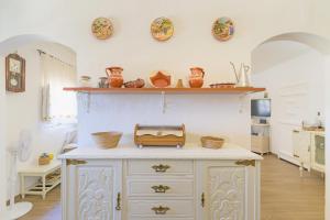 a kitchen with a counter with a toaster on it at Celestial Melides Country House in Melides