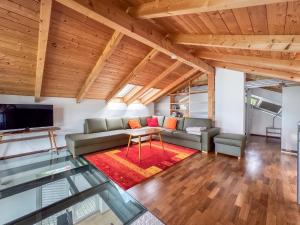 a living room with a couch and a table at Ferienhaus Pippan in Velden am Wörthersee
