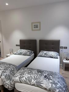 two beds sitting next to each other in a room at Casa Edoardo in Cavedine +74 photos