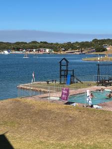 a water park with a playground and a water slide at Marina stunning escape in Jeffreys Bay