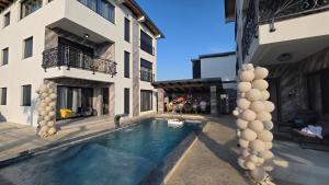 a swimming pool in the courtyard of a building at Vile Relax in Donji Štoj