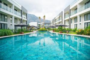a swimming pool in the middle of a building at Palmera Resort Wellness & SPA in Kyrenia