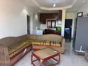a living room with a couch and a table at Hilltop Villa Sengabay in Salima