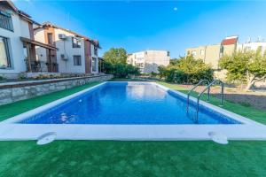 a swimming pool in the middle of a yard at Smokinite Villa 1 - Pool and BBQ near the beach in Varna City