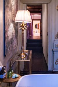 a lamp sitting on a table in a room at Hotel Heureka in Venice