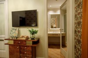 a bathroom with a sink and a mirror at Hotel Parrasio in Rome