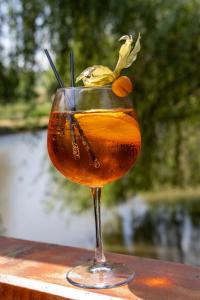 a drink in a glass sitting on a table at Complex Turistic Suatu in Suatul +19 photos