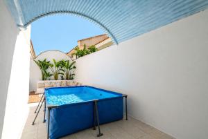 a hot tub on the balcony of a house at Casa dos mares in San Javier