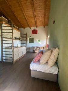 a living room with a couch and a kitchen at Tempo al Tempo in Villadeati +37 photos