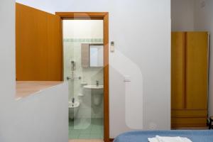 a bathroom with a shower and a toilet and a sink at Affittacamere Il Giardino in Alba Adriatica