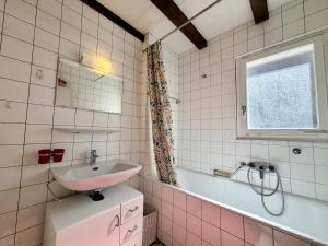 a bathroom with a sink and a toilet and a tub at Cache-Cache MOUNTAIN & QUIET chalet 10 pers in Veysonnaz +55 photos