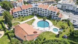 an aerial view of a building with a swimming pool at #081 1BR Vale Mangude Pool & Location in Albufeira