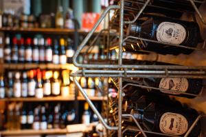 a bunch of bottles of wine on a shelf at La Maison de Laulie in Bagnères-de-Bigorre +22 photos