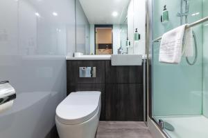 a bathroom with a toilet and a shower at easyHotel Oxford in Oxford