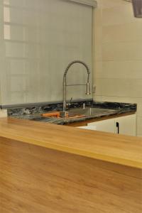 a kitchen counter with a sink and a sink at Top city Homes in Lagos +65 photos