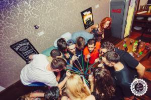 a group of people standing around in a room at Greg&Tom Beer House Hostel in Krakow