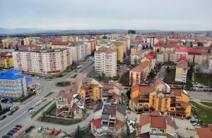an aerial view of a city with buildings at Rania Penthouse 2 in Şelimbăr +1 photo