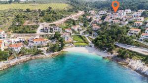 an aerial view of a beach with a hot air balloon at House Postira Horizon in Postira