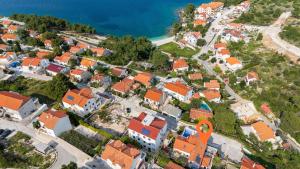 an aerial view of a town with orange roofs at House Postira Horizon in Postira