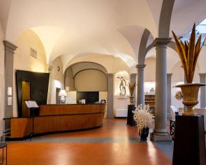 a lobby with a reception desk in a building at Relais Hotel Centrale "Dimora Storica" in Florence