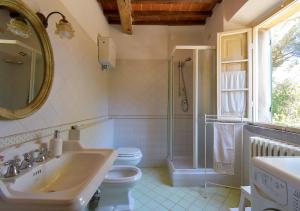 a bathroom with a sink and a toilet and a shower at Il Maggese in Cortona +50 photos