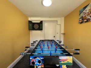 a large conference room with a long table with chairs at Full Apartment in the Heart of Margate in Margate