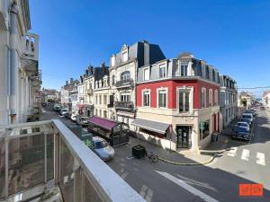 a view from a balcony of a street with buildings at L'ancrage in Wimereux