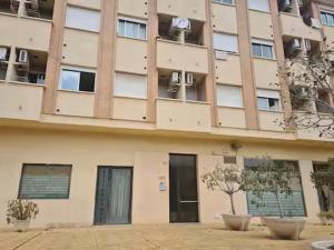 a large building with windows and a door at Aprt ESTUDIO ARRIXACA in Murcia