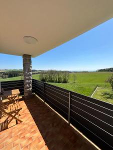 a balcony with a view of a field at Mühlviertler Auszeit in Pisling