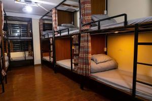 a group of bunk beds in a room at Su Ha Giang Hostel in Ha Giang +15 photos