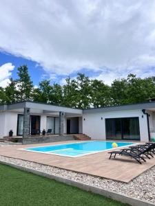 a swimming pool in the backyard of a house at Luxury Villa Grey in Široki Brijeg