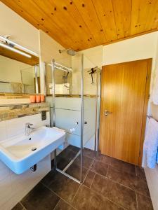 a bathroom with a sink and a shower at Ferienwohnung Beim Raffner, Bergblick, Natur, Ruhpolding in Ruhpolding +54 photos