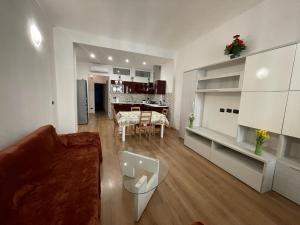 a living room with a couch and a table at Priamar house in Savona