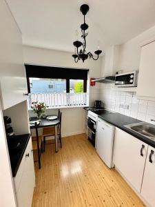 a kitchen with a table and a counter top at Inisfail in Killarney
