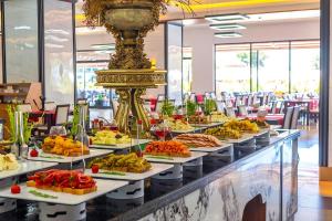 a buffet line with many different types of food at Casa Fora Beach Resort Hotel - Spa & Aqua park - All Inclusive Plus Concept in Belek